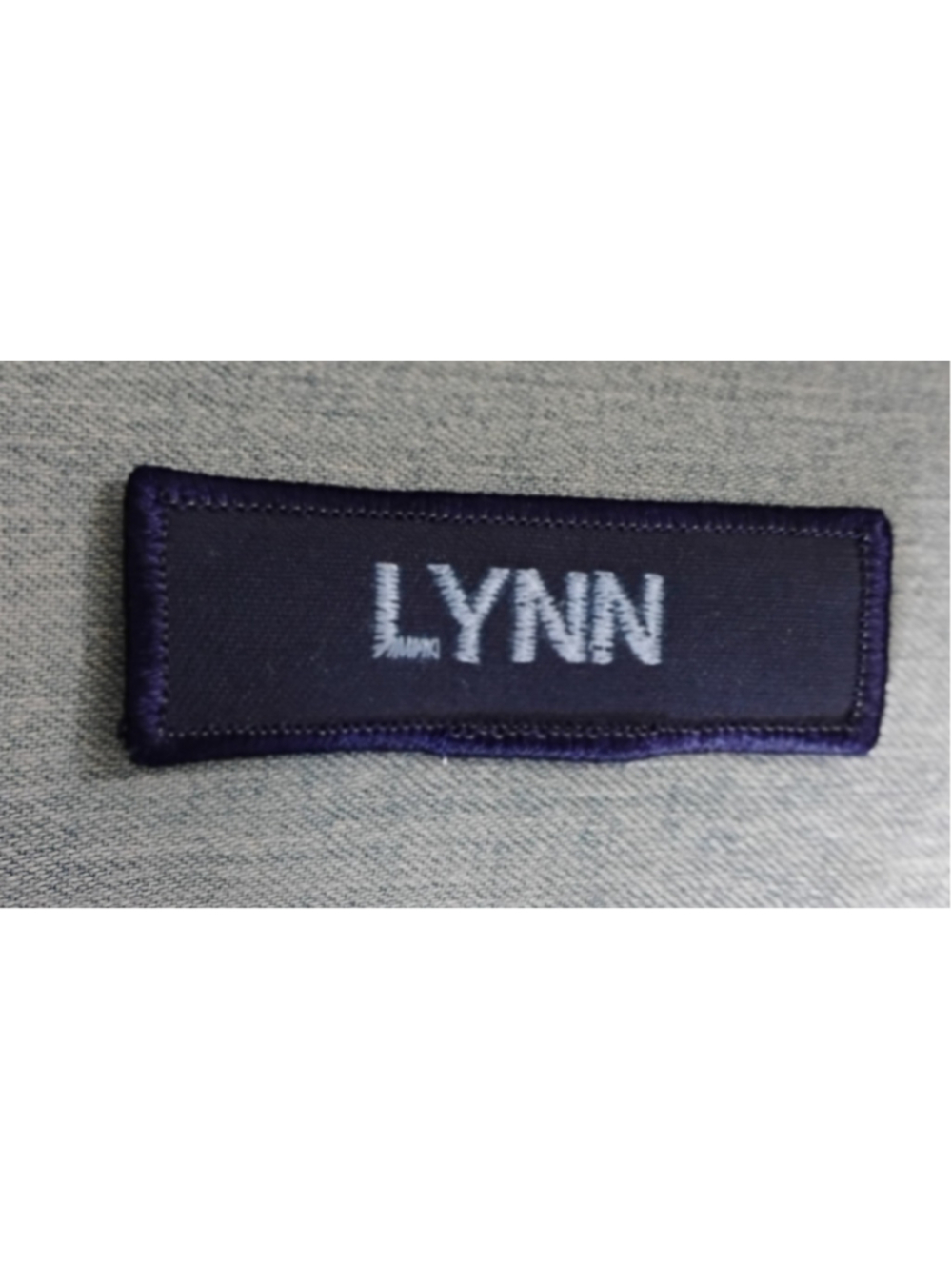 Embroidered navy blue name patch LYNN 3x1"